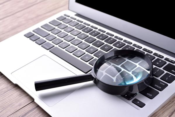 Magnifying glass on a laptop