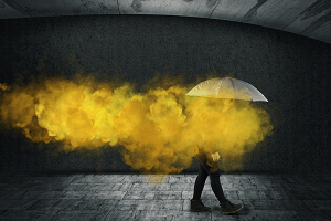 person with umbrella and yellow smoke